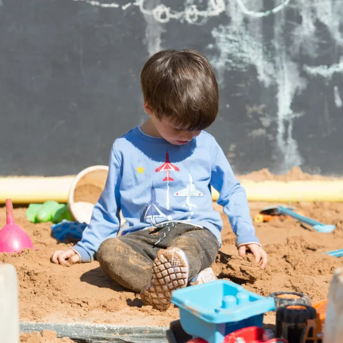 Boy in sandpit