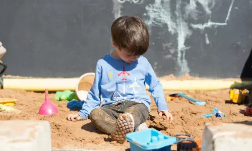 Boy in sandpit